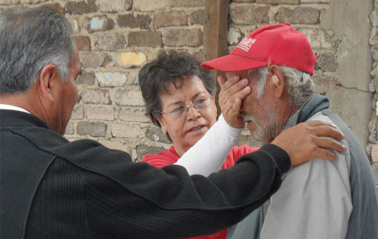 Rosi praying for healing