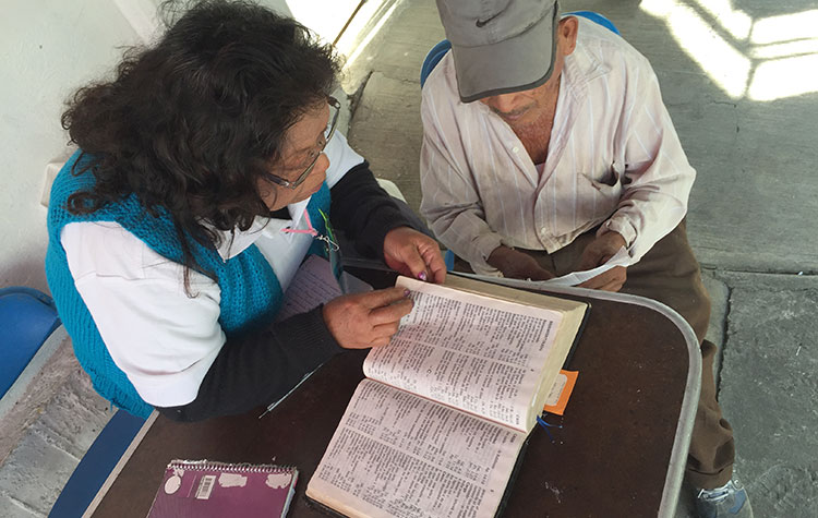 An OSI Ministry team member shares the Word of God